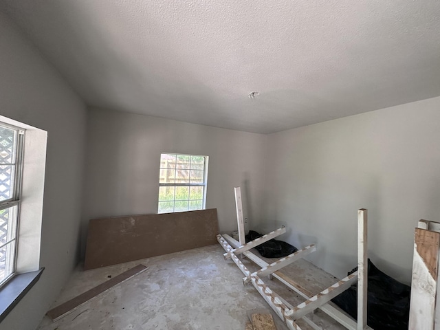 interior space with a textured ceiling