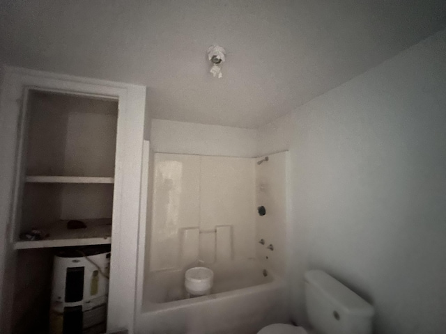 bathroom with toilet and shower / bathing tub combination