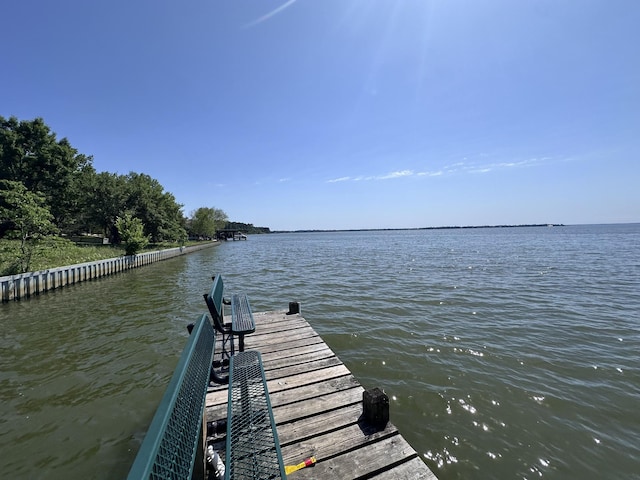 view of dock with a water view