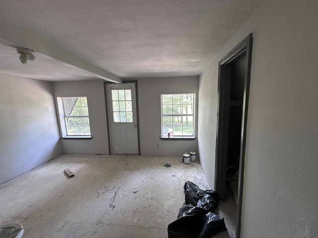 empty room with a textured ceiling