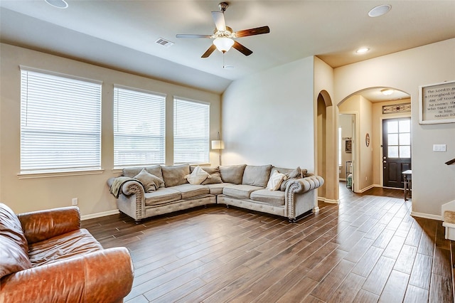 29114 Autumn Brook Dr, Fulshear, TX 77441 - living area with visible vents, baseboards, arched walkways, a ceiling fan, and dark wood-type flooring