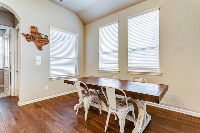 29114 Autumn Brook Dr, Fulshear, TX 77441 - dining room with dark wood-type flooring, baseboards, arched walkways, and lofted ceiling