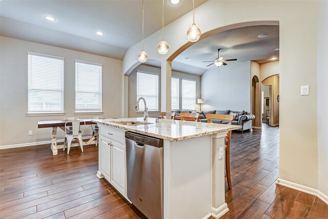 29114 Autumn Brook Dr, Fulshear, TX 77441 - kitchen with arched walkways, dishwasher, a sink, ceiling fan, and dark wood finished floors
