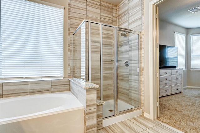 29114 Autumn Brook Dr, Fulshear, TX 77441 - full bath with visible vents, tile patterned floors, a stall shower, and a garden tub