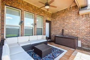 view of patio with an outdoor living space and a ceiling fan