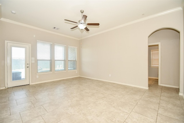 spare room with crown molding, ceiling fan, light tile patterned floors, arched walkways, and visible vents