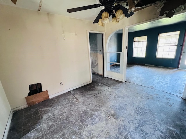 7413 W Knoll St, Houston, TX 77028 - unfurnished room featuring arched walkways and ceiling fan