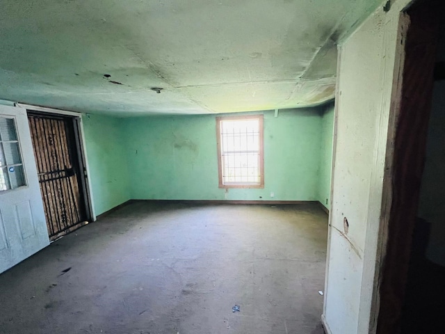 7413 W Knoll St, Houston, TX 77028 - unfurnished room with concrete floors