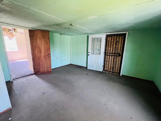 7413 W Knoll St, Houston, TX 77028 - empty room featuring unfinished concrete floors