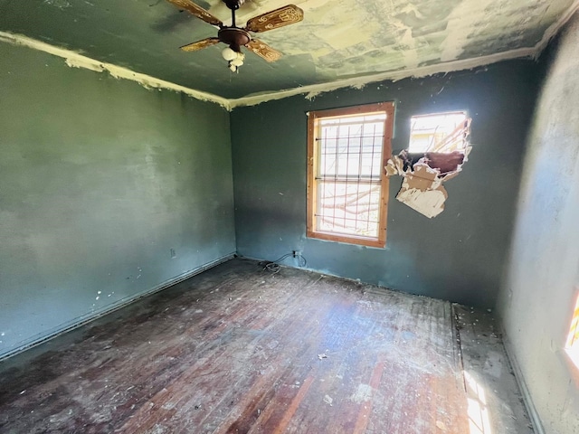 7413 W Knoll St, Houston, TX 77028 - empty room with a ceiling fan and wood-type flooring