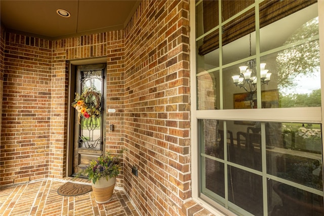 entrance to property with brick siding