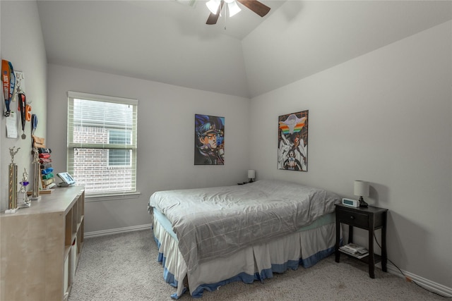 bedroom featuring baseboards, ceiling fan, light colored carpet, and vaulted ceiling