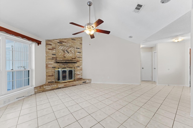 unfurnished living room with light tile patterned floors, visible vents, ceiling fan, and vaulted ceiling