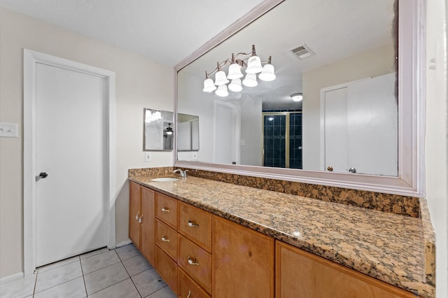 full bathroom with tile patterned floors, visible vents, and vanity