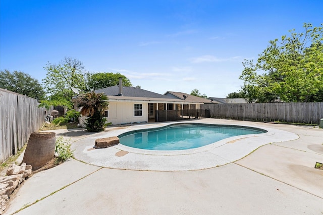 view of pool with a fenced backyard, a fenced in pool, and a patio area