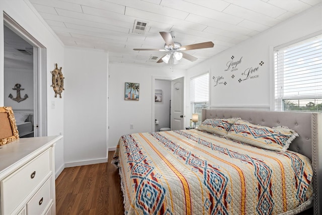 bedroom featuring ceiling fan, wood finished floors, and visible vents
