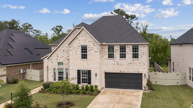 17583 Harpers Way, Conroe, TX 77385 - french country home featuring driveway, a front yard, an attached garage, fence, and brick siding