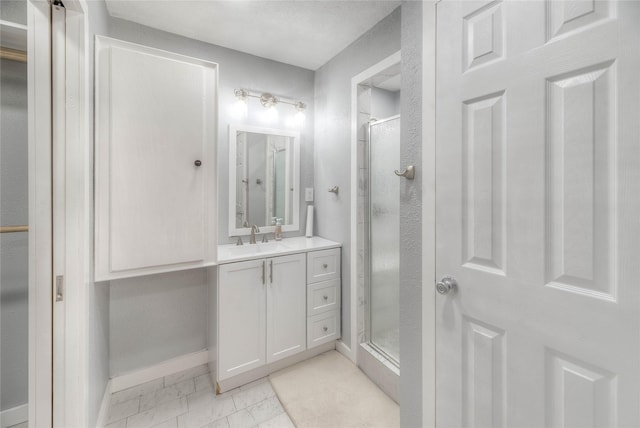 25 S Magnolia Ln, Shepherd, TX 77371 - bathroom with vanity, baseboards, marble finish floor, and a shower stall