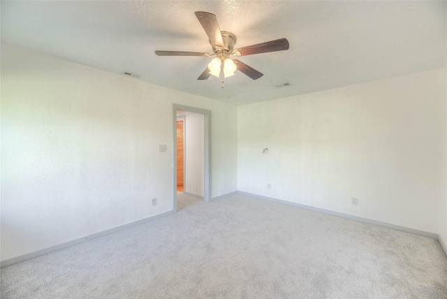 25 S Magnolia Ln, Shepherd, TX 77371 - empty room featuring ceiling fan, visible vents, baseboards, and light carpet