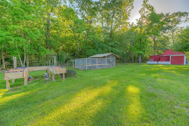 25 S Magnolia Ln, Shepherd, TX 77371 - view of yard featuring an outdoor structure and a garage