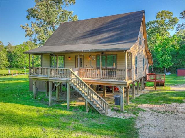 25 S Magnolia Ln, Shepherd, TX 77371 - view of front of home featuring stairway, covered porch, and a front yard