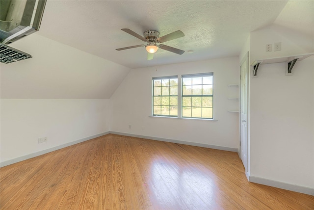 25 S Magnolia Ln, Shepherd, TX 77371 - additional living space with light wood finished floors, lofted ceiling, a ceiling fan, and baseboards