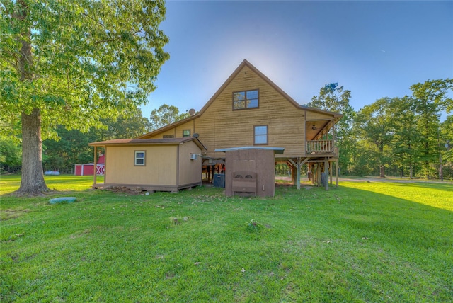 25 S Magnolia Ln, Shepherd, TX 77371 - back of property with a yard, a wooden deck, and an outbuilding