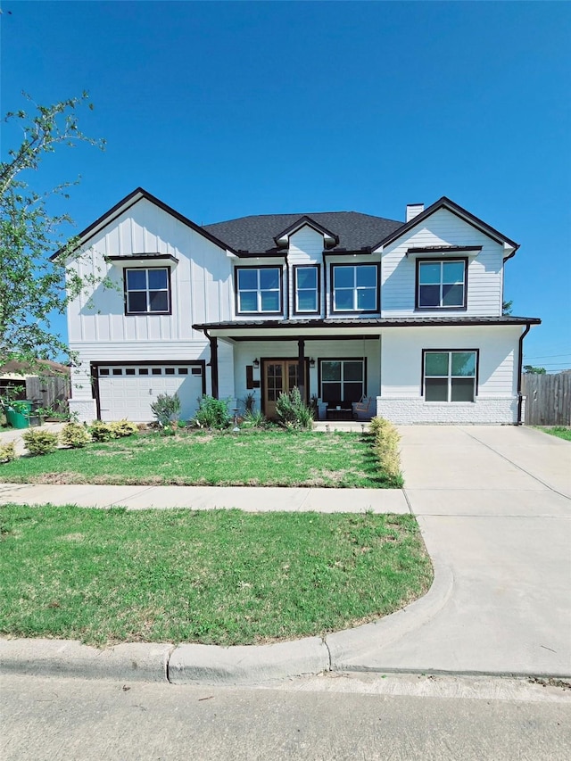 8006 Longridge Dr, Houston, TX 77055 - view of front of house with a front lawn, fence, and concrete driveway