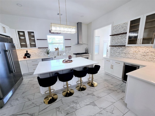 8006 Longridge Dr, Houston, TX 77055 - kitchen featuring backsplash, open shelves, high end appliances, wall chimney exhaust hood, and marble finish floor