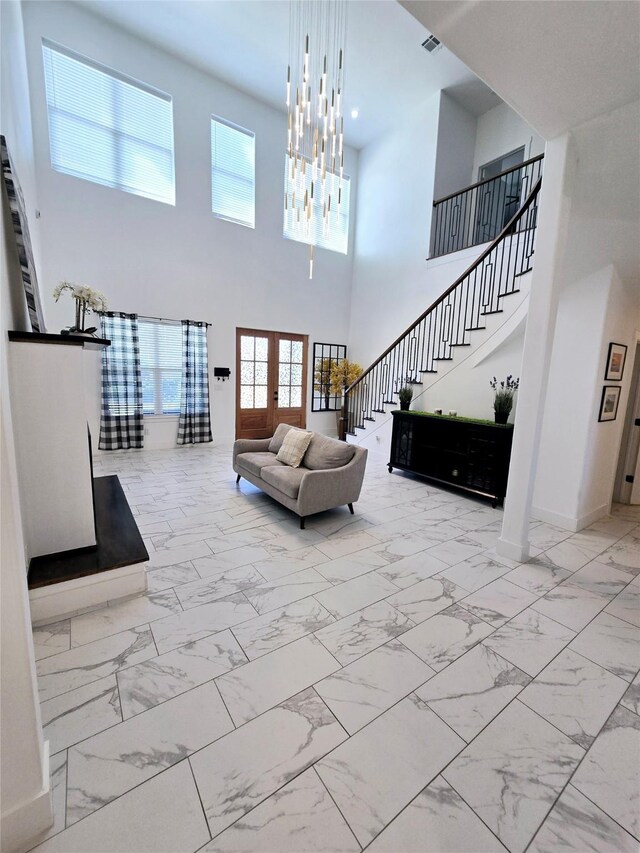 8006 Longridge Dr, Houston, TX 77055 - living room with stairway, marble finish floor, plenty of natural light, and a towering ceiling