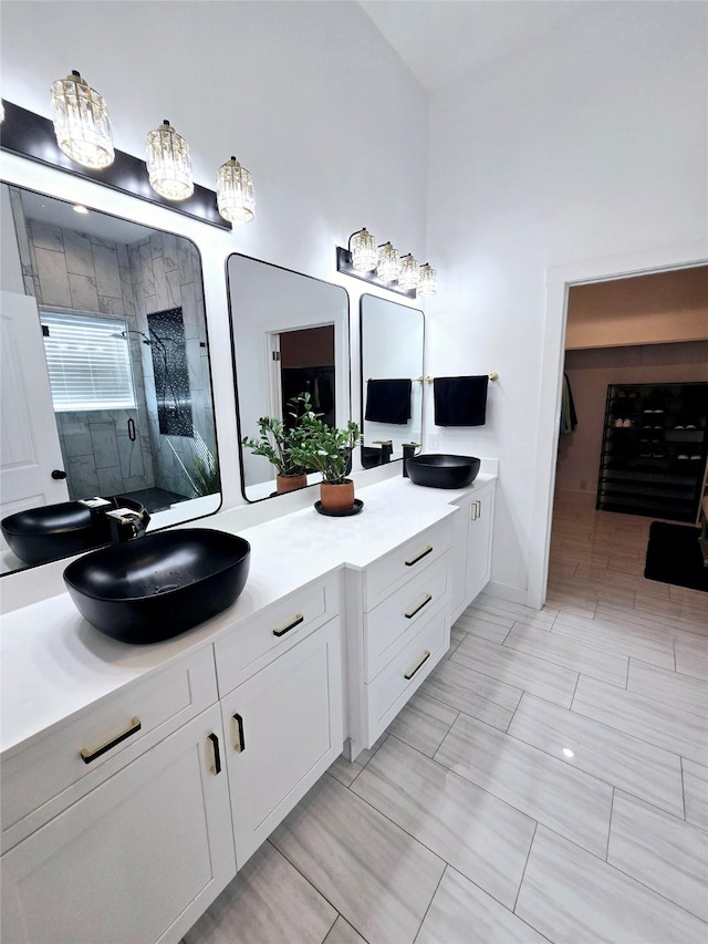 8006 Longridge Dr, Houston, TX 77055 - full bathroom featuring double vanity, a sink, and a stall shower