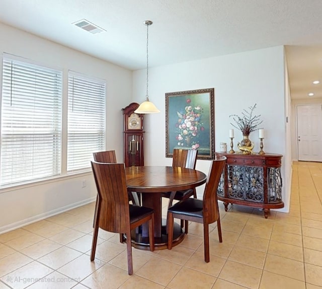 dining area featuring visible vents, baseboards, and light tile patterned floors