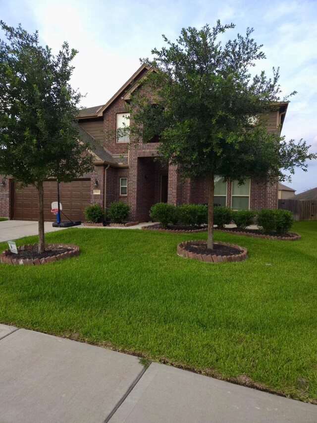 19003 Bene Vista Dr, Houston, TX 77084 - view of property hidden behind natural elements featuring brick siding and concrete driveway