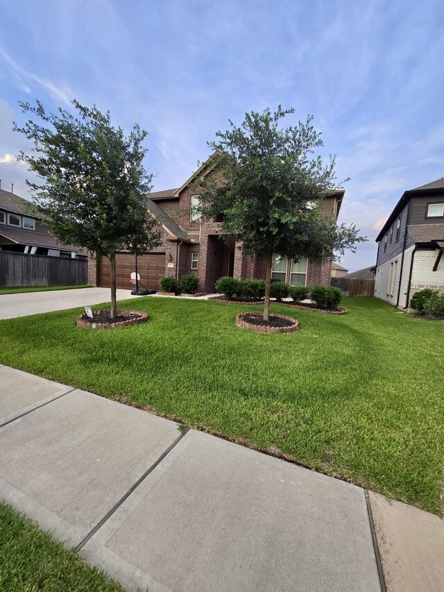 19003 Bene Vista Dr, Houston, TX 77084 - view of front of home with brick siding, concrete driveway, and an attached garage