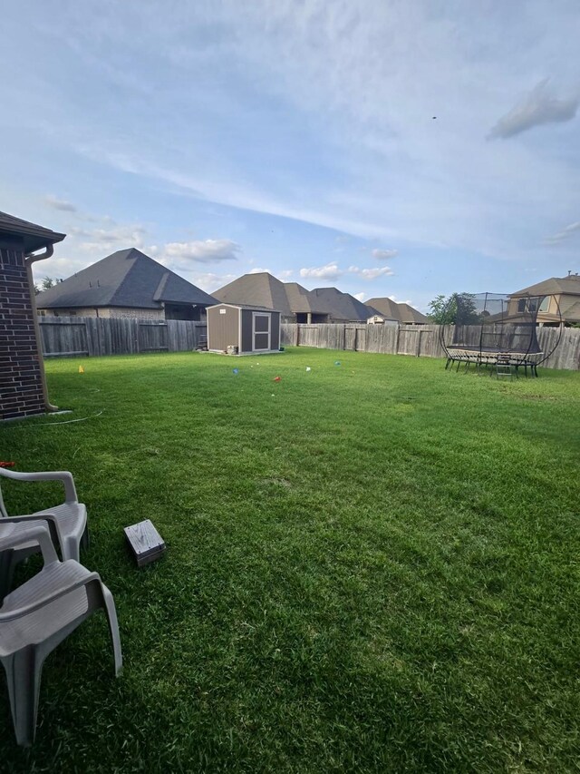 19003 Bene Vista Dr, Houston, TX 77084 - view of yard featuring a trampoline and a residential view