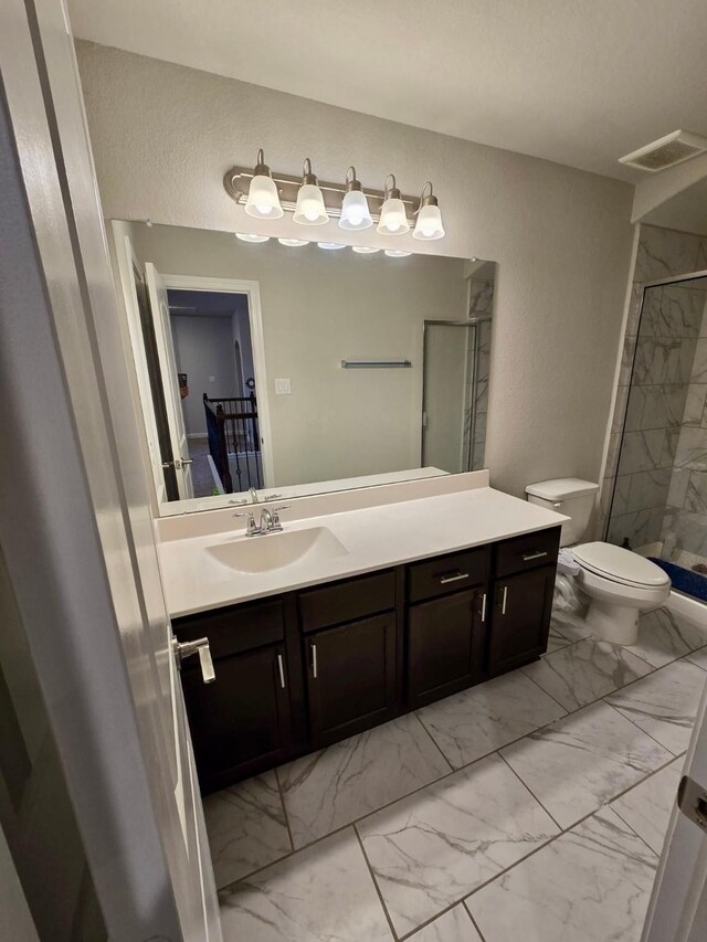 19003 Bene Vista Dr, Houston, TX 77084 - full bathroom featuring marble look tiles, vanity, toilet, and a shower stall