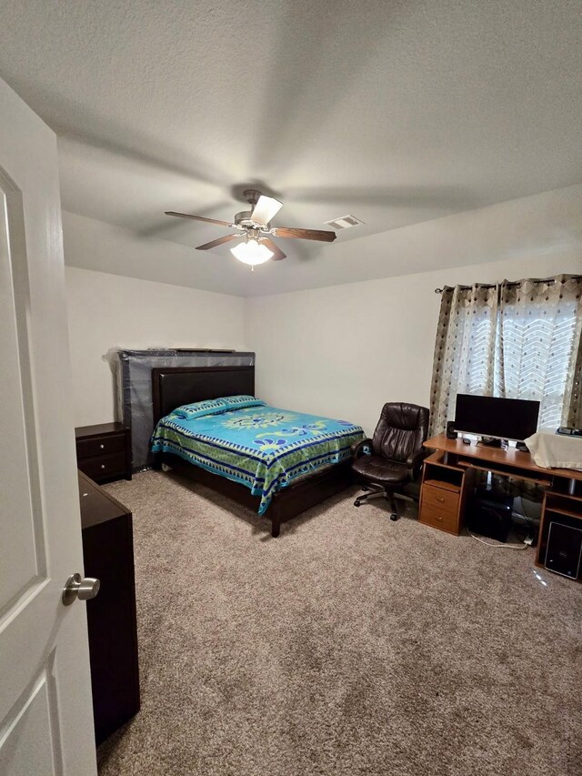 19003 Bene Vista Dr, Houston, TX 77084 - bedroom featuring carpet, a ceiling fan, and a textured ceiling