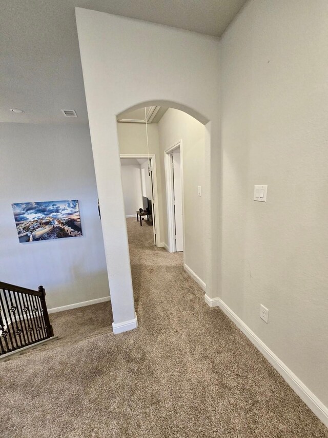 19003 Bene Vista Dr, Houston, TX 77084 - corridor featuring arched walkways, carpet floors, and baseboards