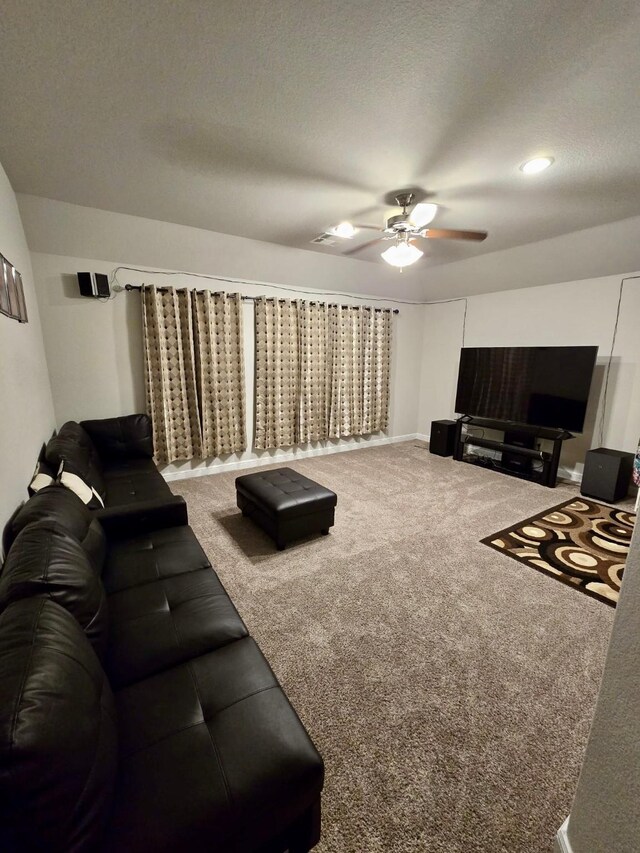 19003 Bene Vista Dr, Houston, TX 77084 - living room featuring ceiling fan, carpet flooring, and a textured ceiling