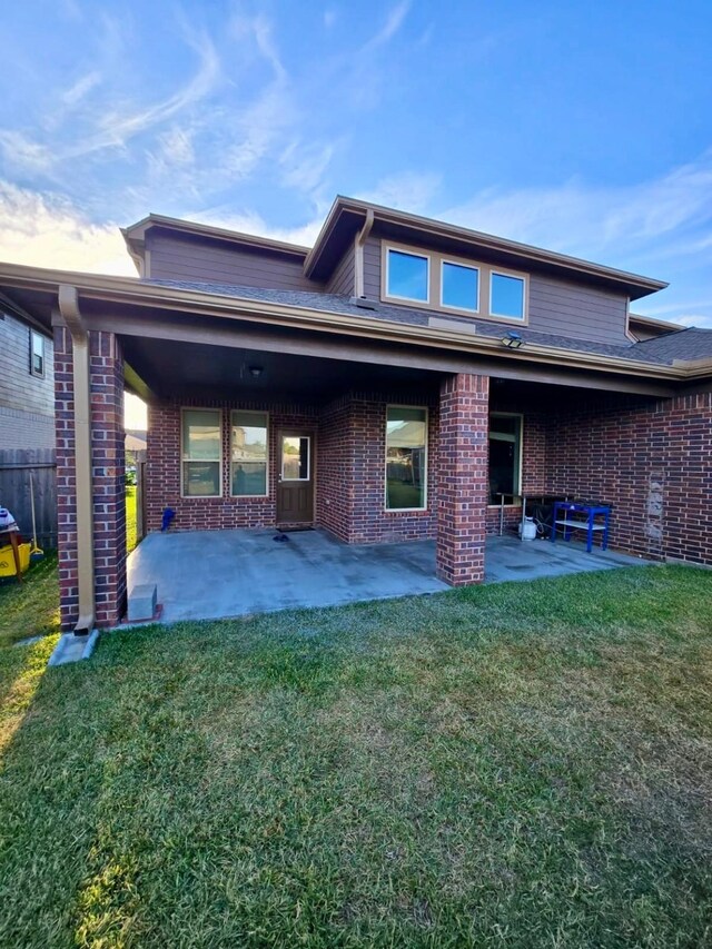 19003 Bene Vista Dr, Houston, TX 77084 - rear view of house with brick siding and a patio area