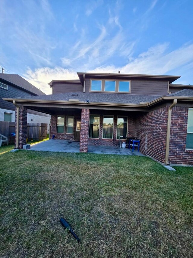 19003 Bene Vista Dr, Houston, TX 77084 - back of property with a patio and brick siding