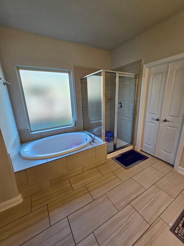 19003 Bene Vista Dr, Houston, TX 77084 - full bath featuring a stall shower and a garden tub