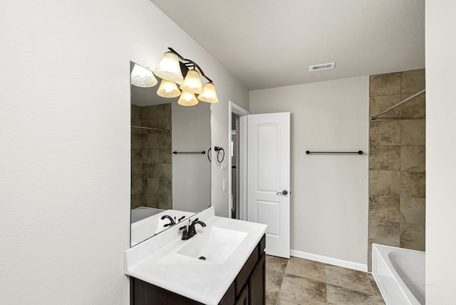 26818 Lindenwood Creek Ln, Katy, TX 77494 - bathroom featuring vanity, tub / shower combination, and stone finish flooring