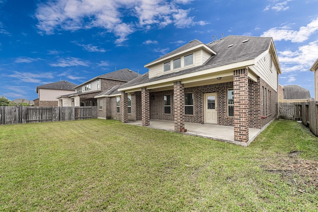 26818 Lindenwood Creek Ln, Katy, TX 77494 - back of house with brick siding, a fenced backyard, and a patio area