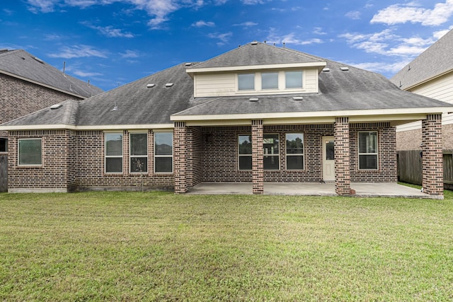 26818 Lindenwood Creek Ln, Katy, TX 77494 - rear view of house featuring brick siding, a patio, and roof with shingles
