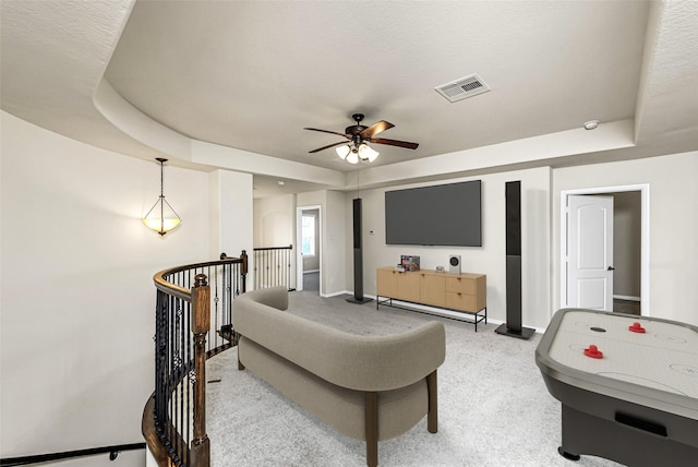 26818 Lindenwood Creek Ln, Katy, TX 77494 - living room with ceiling fan, a raised ceiling, and light carpet