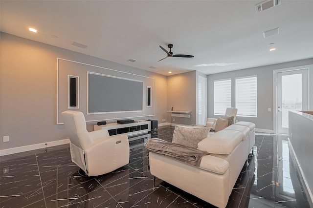 cinema room with recessed lighting, granite finish floor, baseboards, visible vents, and a ceiling fan