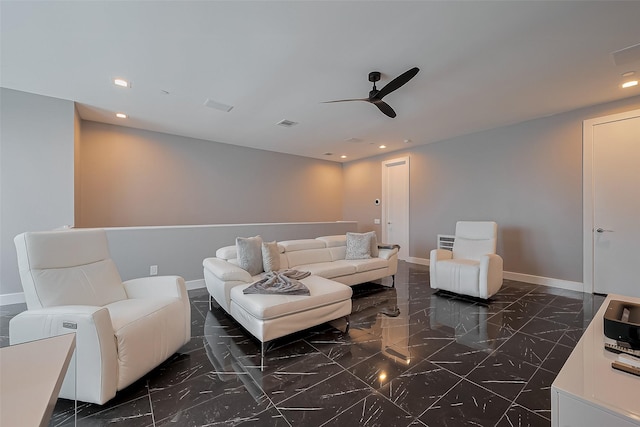 living room with baseboards, recessed lighting, ceiling fan, and marble finish floor