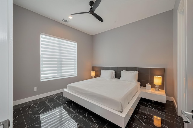bedroom featuring visible vents, a ceiling fan, marble finish floor, and baseboards