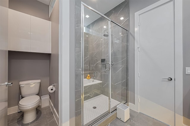 full bath with a stall shower, marble finish floor, and baseboards
